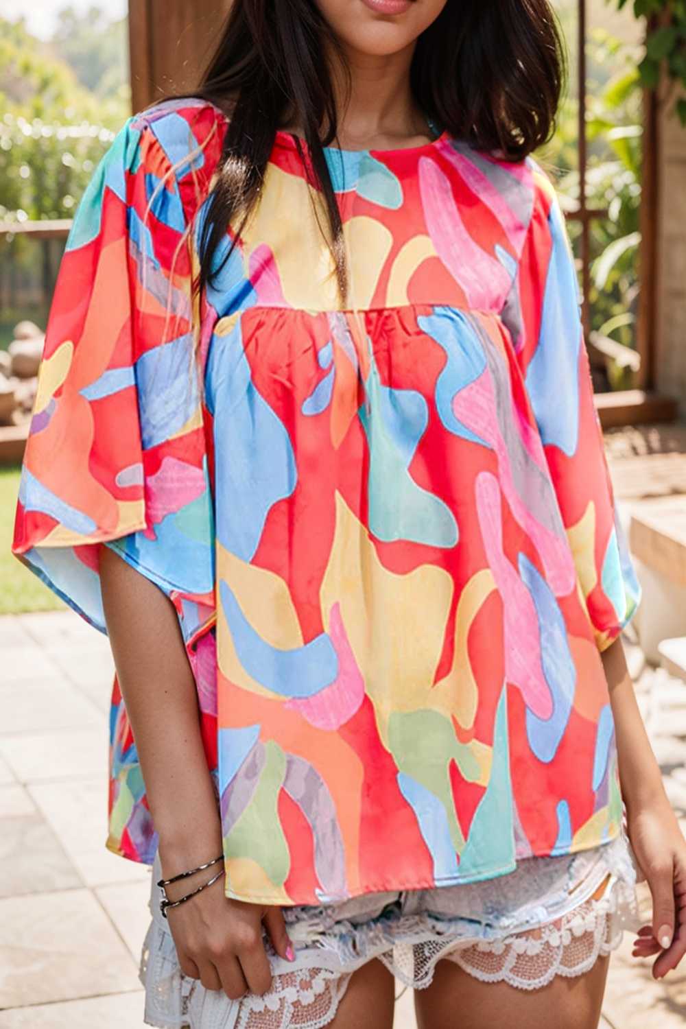 vibrant abstract print flowy sleeve round neck top